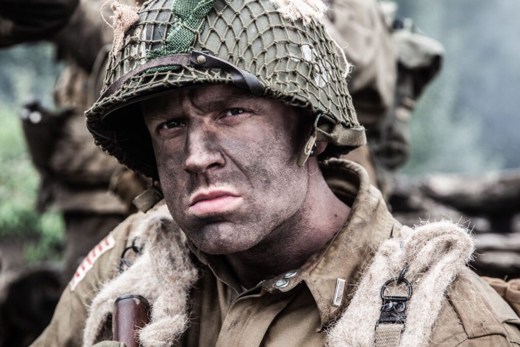 Lieutenant Provost looks scans for a German Machine Gun Nest near Carentan, France. (Dramatic Recreation) Gavin Marck