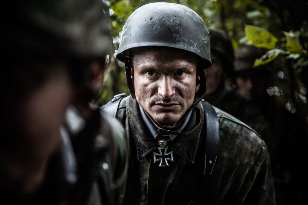 German Soldiers advance through the hedgerows near Carentan, France. (Dramatic Recreation) Alessandro Pekin