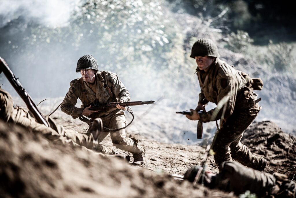 American Soldiers advance against German bunkers on Crucifix Hill. (Dramatic Recreation) L-R: Devin Kotlowski, Gavin Marck