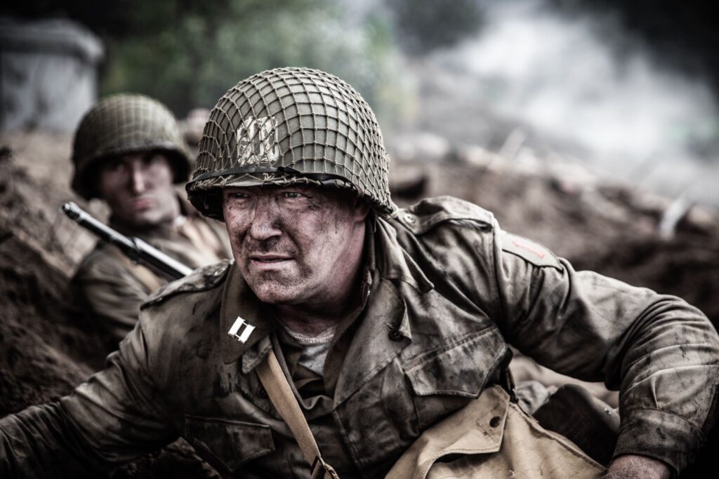 Captain Bobby Brown prepares to leave protective cover to launch his attack against Crucifix Hill. (Dramatic Recreation) L-R: Elliot Wesley, Jason Johnson