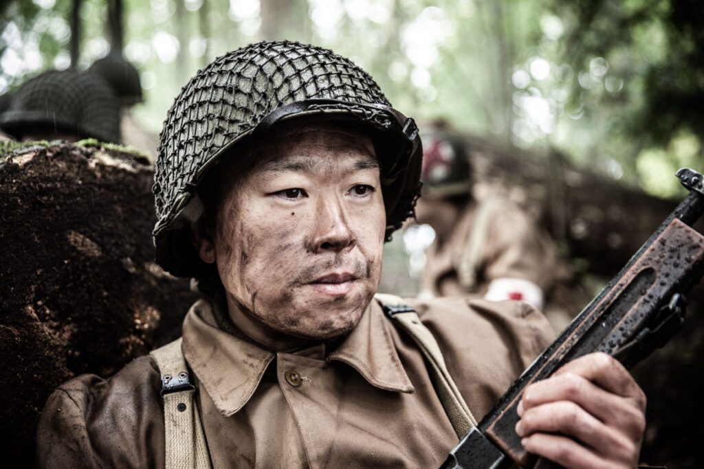 Sergeant Shiro Kashino contemplates his next move during their advance to rescue the Lost Battalion. (Dramatic Recreation) Alex Law