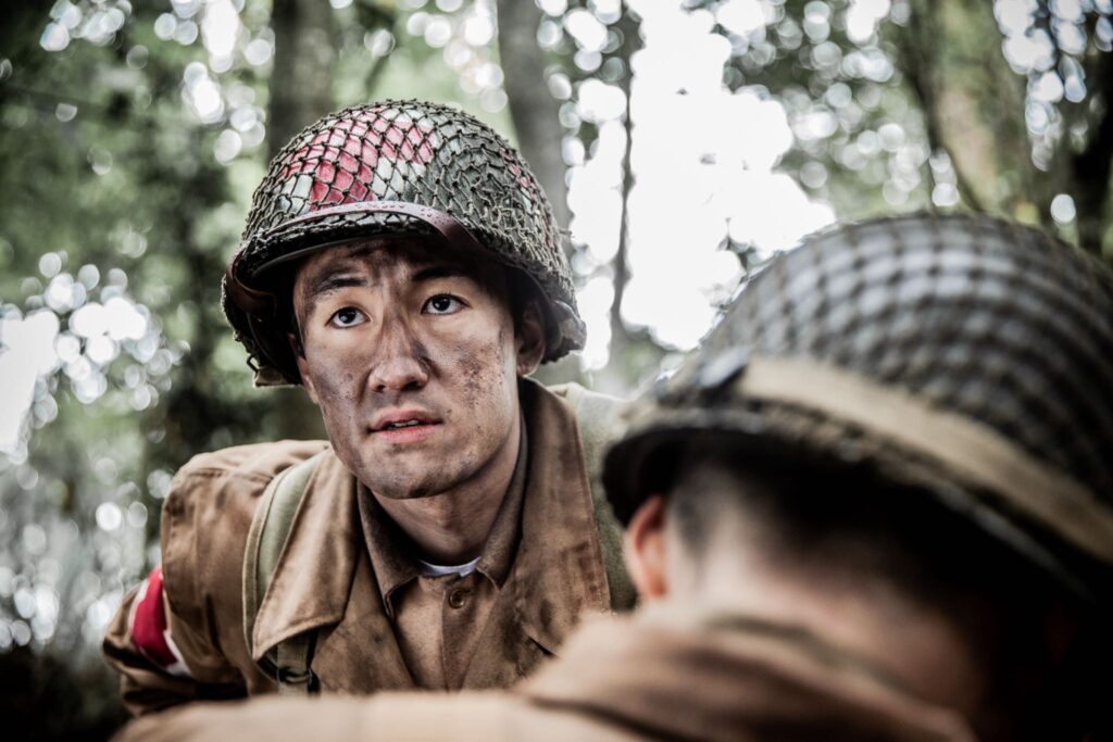 An American Medic looks on after treating a soldier who has died from bullet wounds. (Dramatic Recreation) Gabriel Prevost