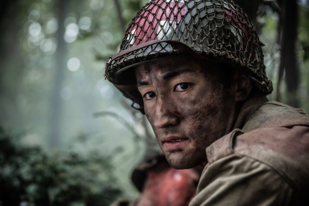 An American Medic prepares to rescue a fellow soldier caught under a fallen tree branch. (Dramatic R ecreation) Gabriel Prevost