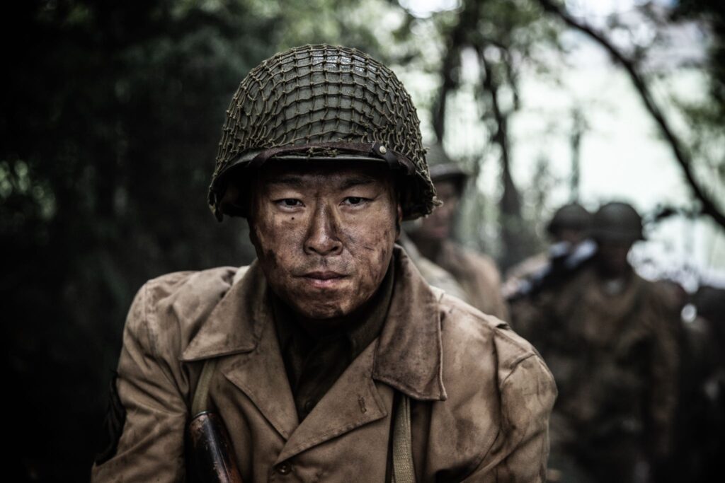 Sergeant Shiro Kashino leads his men through the Vosges Mountains, France. (Dramatic Recreation) Alex Law