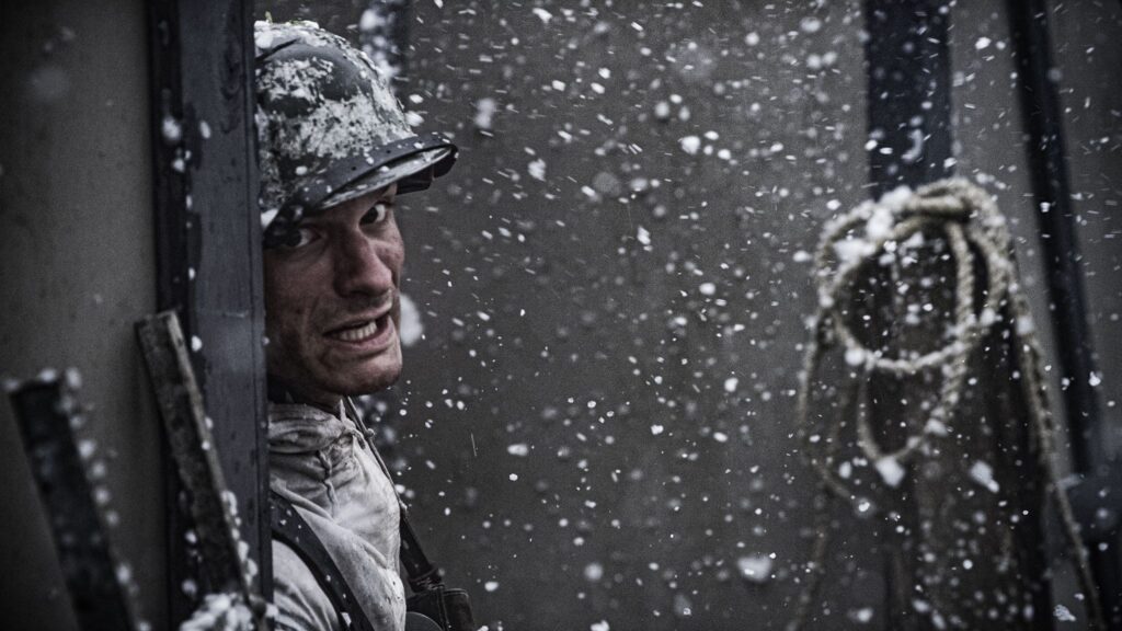 A 35th Panzergrenadier Regiment Soldier takes cover during the battle for Hatten, France. (Dramatic Recreation). Alessandro Pekin.