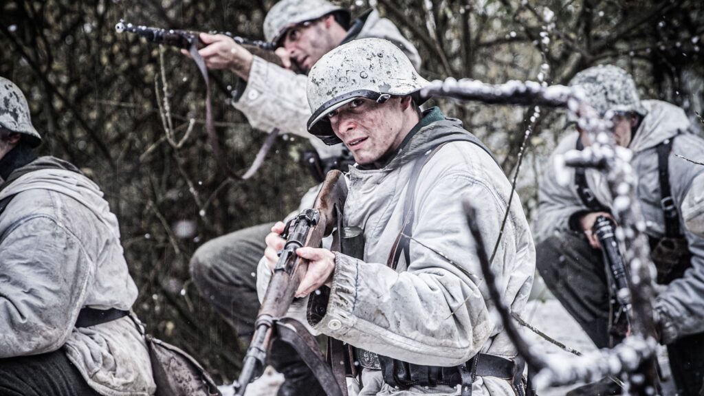 35th Panzergrenadier Regiment Soldiers launch their attack on Hatten, France. (Dramatic Recreation). (Left to Right) Amir Zeino, Kaden Connors, and Alessandro Pekin.