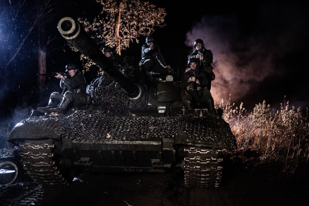 Soldiers of the 9th Panzer Grenadier Regiment advance on a German tank in Northern Italy. (Dramatic Recreation) (Left to Right) Kayler Fagan, David Bell, Alessandro Pekin, Mark Masterton, & Etienne Cote.