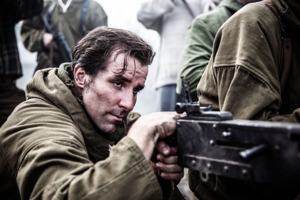 French Maquisard resistance fighter fires machine gun at incoming German troops. (Dramatic Recreation) (Curtis Lovell)