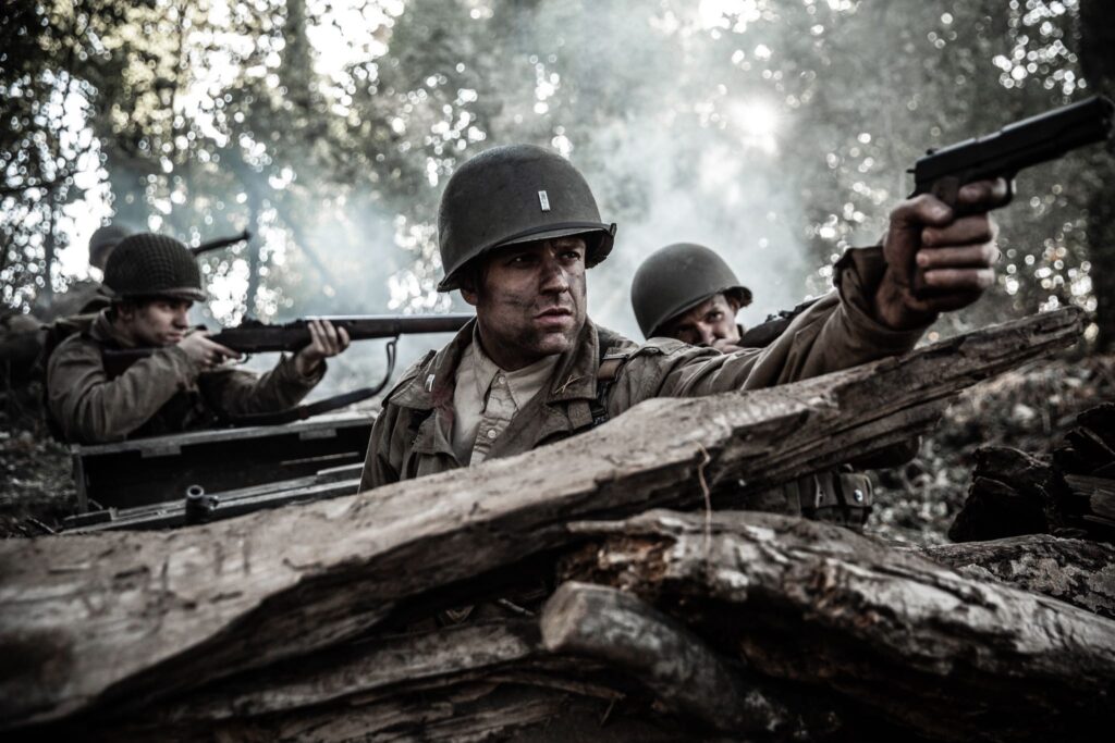 U.S. Lietenant Ralph Kerley and other members of the 120th Infantry Regiment fight off a German attack to retain control of Hill 314. (Dramatic Recreation) (L-R: Kristian Barrett, Gavin Marck, William Grossman)