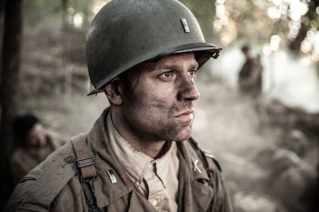 Lietenant Ralph Kerley surrounded by wounded soldiers of of the U.S. 120th Infantry Regiment on Hill 314 . (Dramatic Recreation) (Gavin Marck)