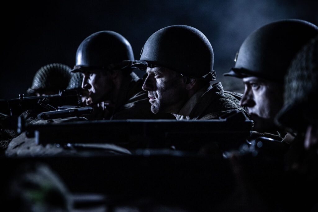 Sergeant Ammon Sasser, Lietenant Robert Weiss, Lietenant Ralph Kerley prepare for a night time attack by German forces. (Dramatic Recreation) (L-R: Kevin Trumble, Gavin Marck, Nathan Plumite)