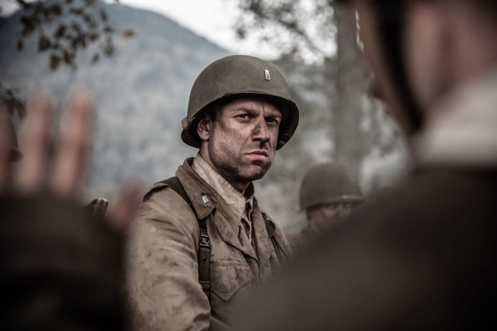 U.S. officer watches the Germans surrender after an ambush. (Dramatic Recreation) (Gavin Marck)