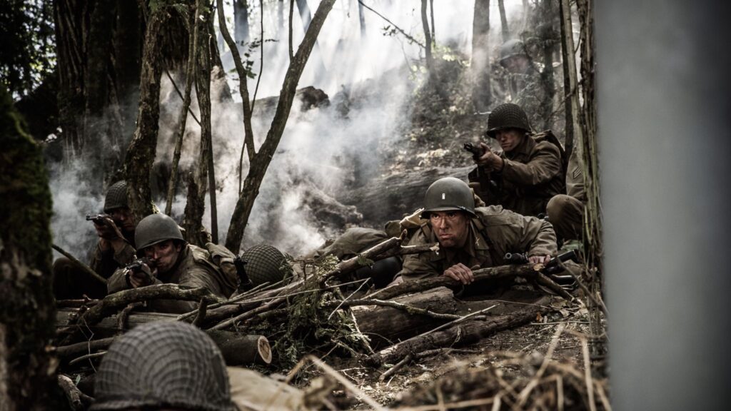 Lieutenant Harris Neil and U.S. soldiers take cover from enemy artillery. (Dramatic Recreation) (L-R:Jarret Aikman, Nathan Ozee, Jonathan Woodhall, Havoc Turchyniak)