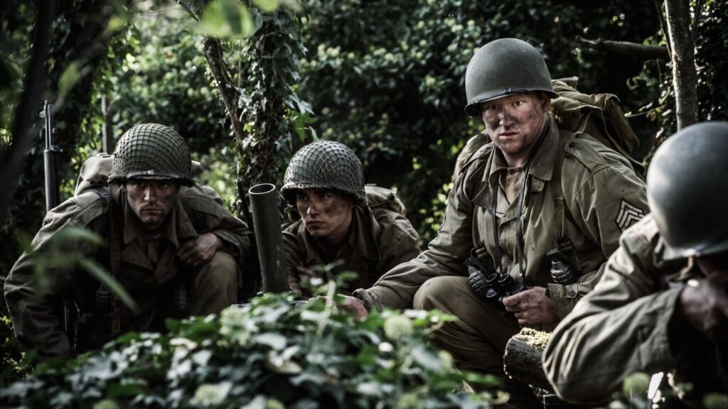 U.S. Soldiers fire mortars against the Germans positions. (Dramatic Recreation) (L-R: Lincoln Tisdale, Zachary Sieber, Kyler Fagan)