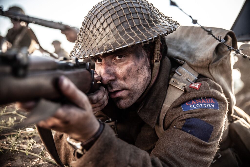 Canadian Acting Major Frederick Tilston fires on a German position. (Dramatic Recreation) (Curtis Lovell)