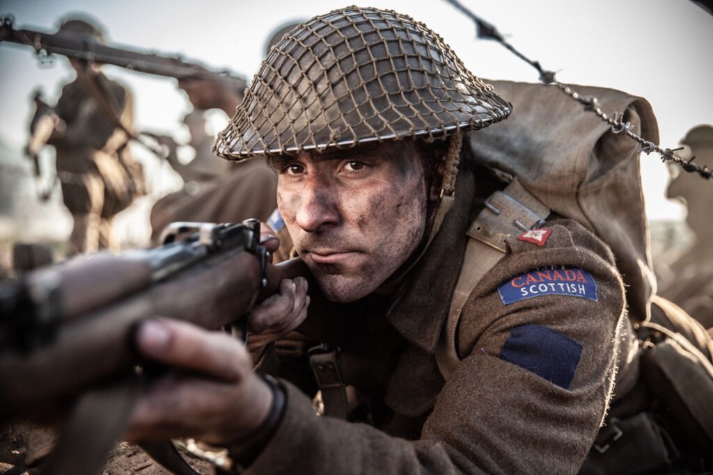 Canadian Acting Major Frederick Tilston fires on a German position. (Dramatic Recreation) (Curtis Lovell)