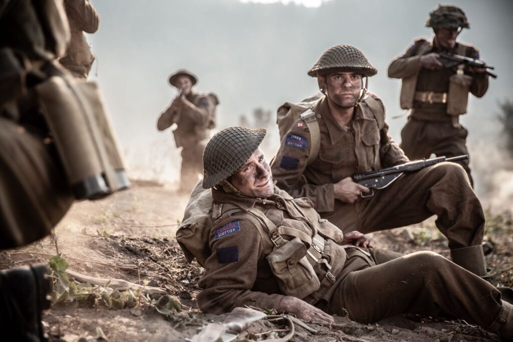 As he approaches a German trench, Canadian Acting Major Frederick Tilston is struck by enemy shrpanel. (Dramatic Recreation) (L-R:Curtis Lovell, Amir Zeino)