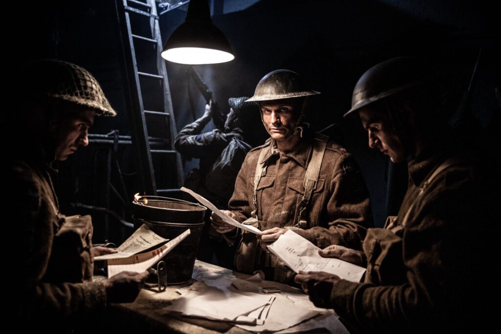 Canadian Lt. Colonel Pangman prepares to burn classified documents as the Germans threaten to capture his headquarters. (Dramatic Recreation) (L-R: Harry Tamacas Perla, Juan Jose Cadotte)