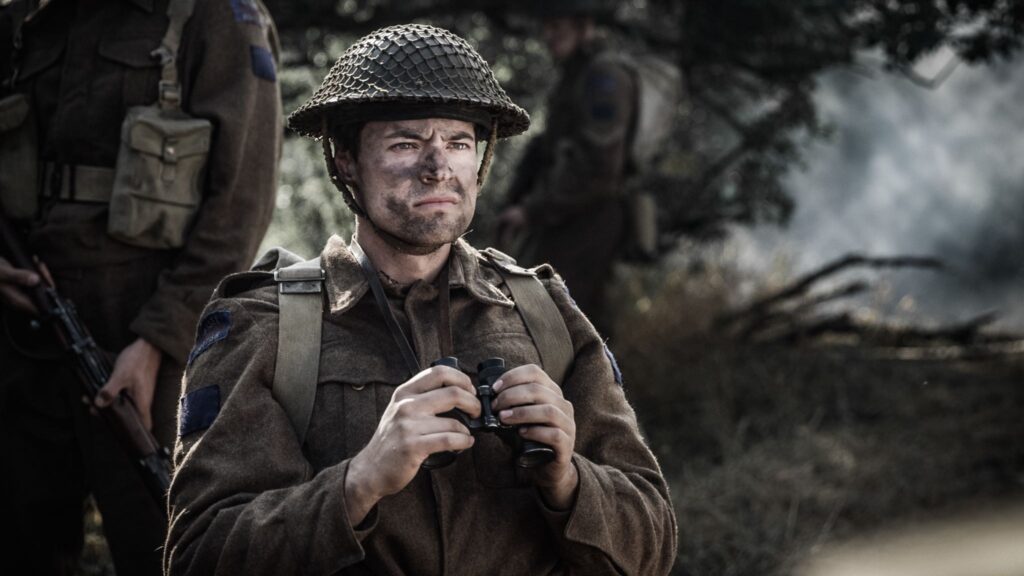 Canadian Major Ken McIntyre watches helplessl as Frederick Tilston is struck by an enemy blast. (Dramatic Recreation) (Nathan Plumite)