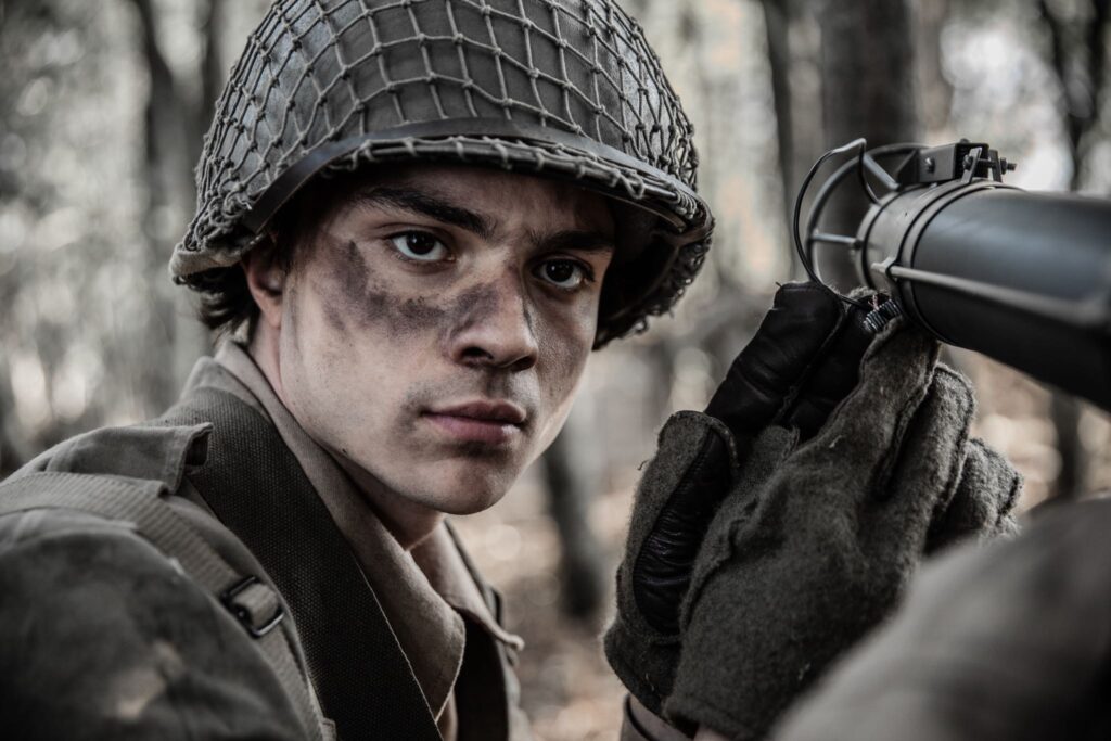 Member of C Company U.S. 8th Infantry loads PFC Delgado's Bazooka. (Dramatic Recreation) (Juan Jose Cadotte)