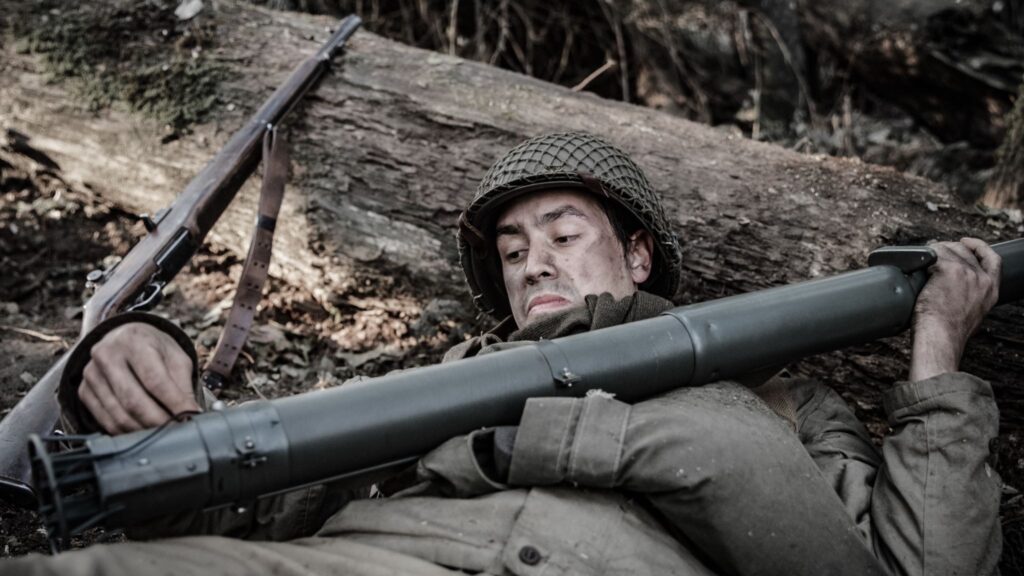 Private Pedro Cano reloads a bazooka during fighting in the Hurtgen Forest. (Dramatic Recreation) (Marcel Faucheret)