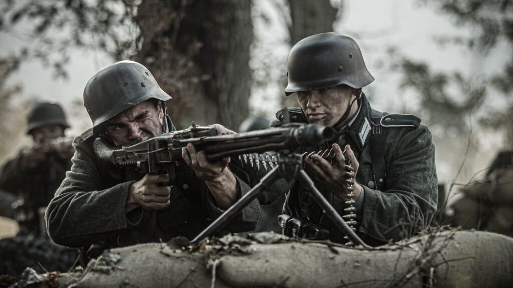 German machine gun nest targets soldiers from the U.S. 8th Infantry Regiment in the Hurtgen Forest. (Dramatic Recreation) (L-R: Lincoln Tisdale & Havoc Turchyniak)