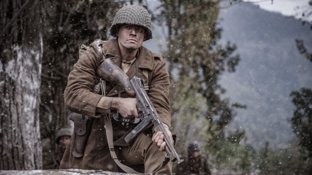 B Company prepares as German tanks and soldiers advancing across the field from the village of Holtzwihr. (Dramatic Recreation) (Nathan Plumite)