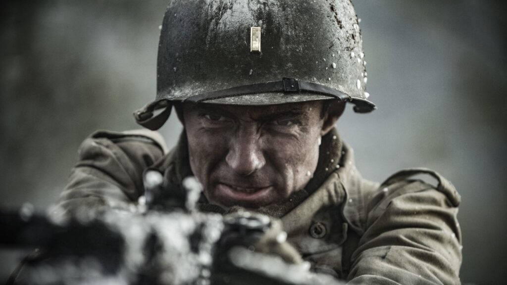 2nd Lieutenant Audie Murphy swings the 50-caliber gun and begins to fire into the attacking German infantry. (Dramatic Recreation) (William Redfern)