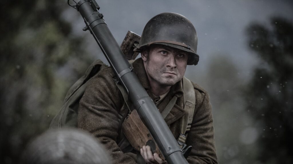 An American soldier prepares to fire a bazooka at the advancing German tank. (Dramatic Recreation) (Joseph Mckerricher)